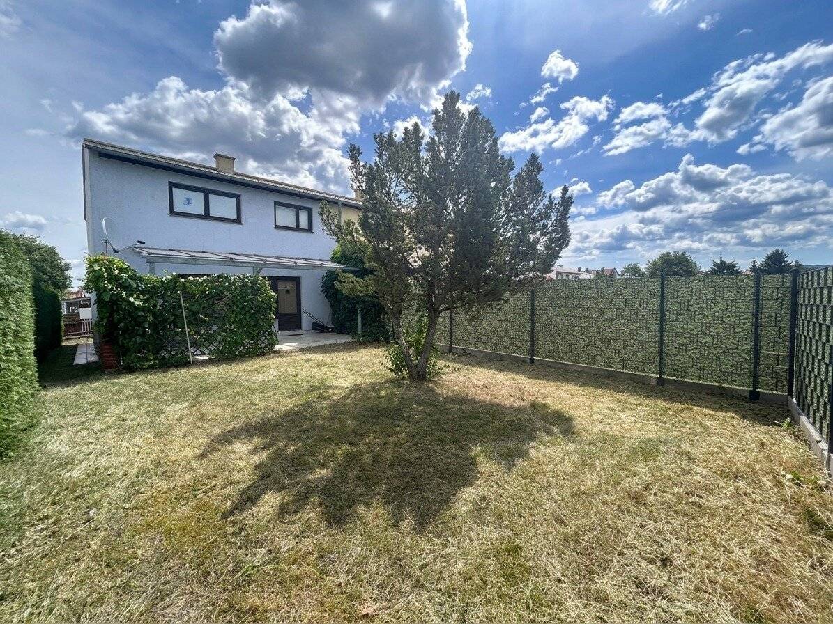 Charming corner terraced house with distant view of the greenery, garden, garage and parking space in Pottschach