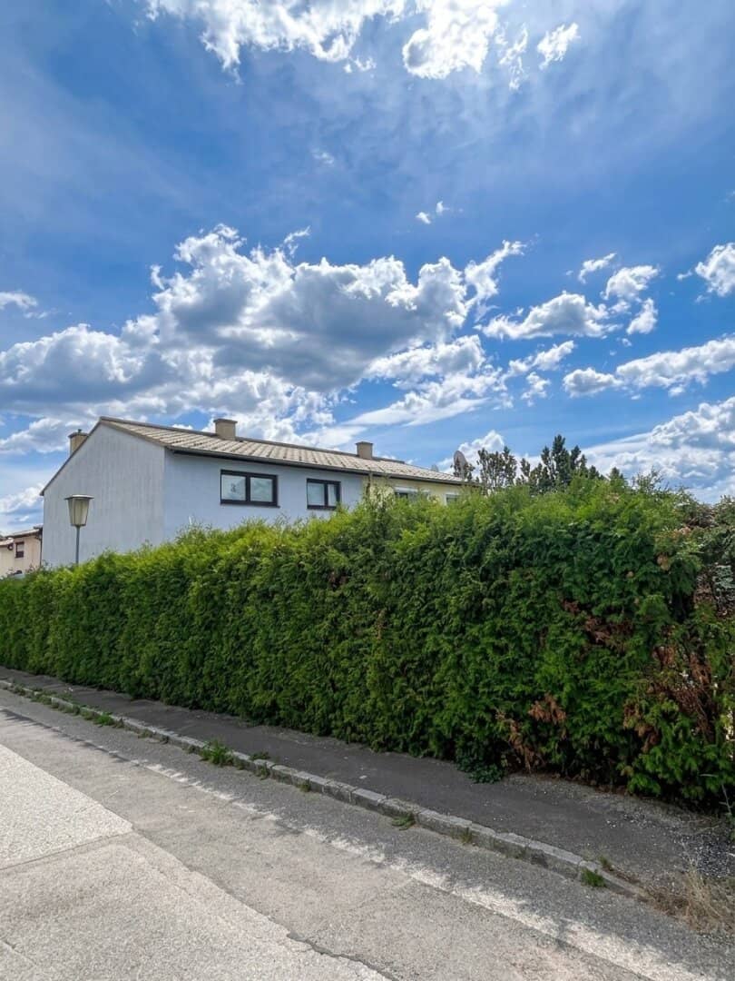 Charming corner terraced house with distant view of the greenery, garden, garage and parking space in Pottschach