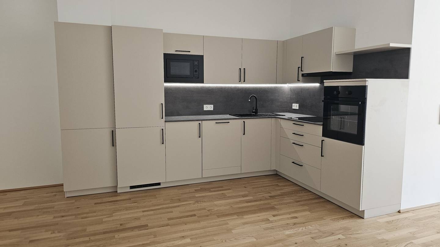 NEUBAU - ERSTBEZUG - GARTENWOHNUNG - Top 2a - Wunderschöne 2 Zimmerwohnung mit kleinem Garten, Terrasse und einem eigenen Tiefgaragenplatz