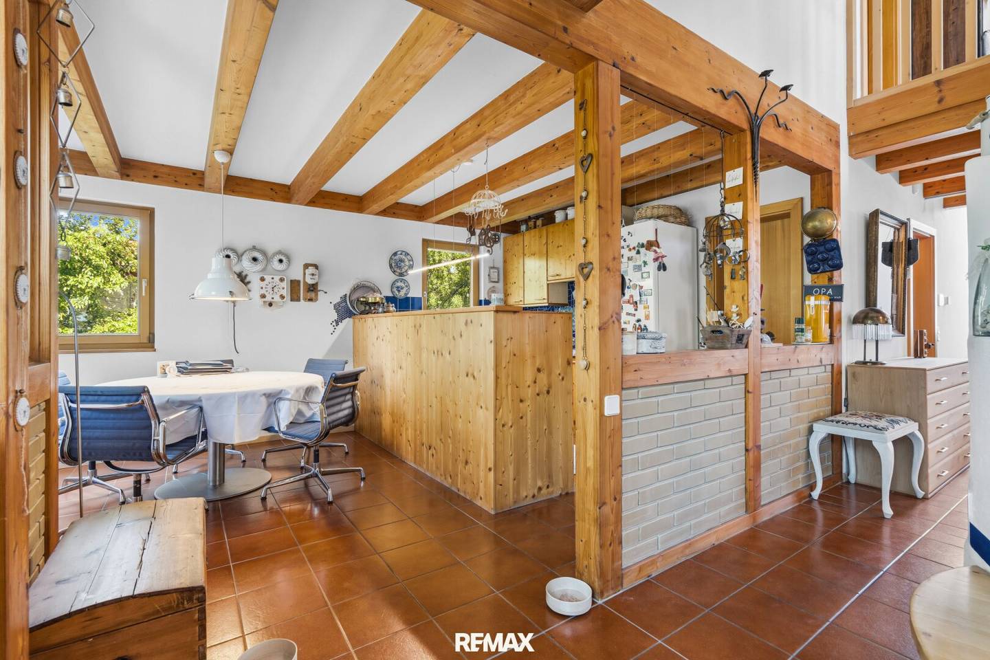 Light-filled single-family house in country house style with natural pool in a garden paradise