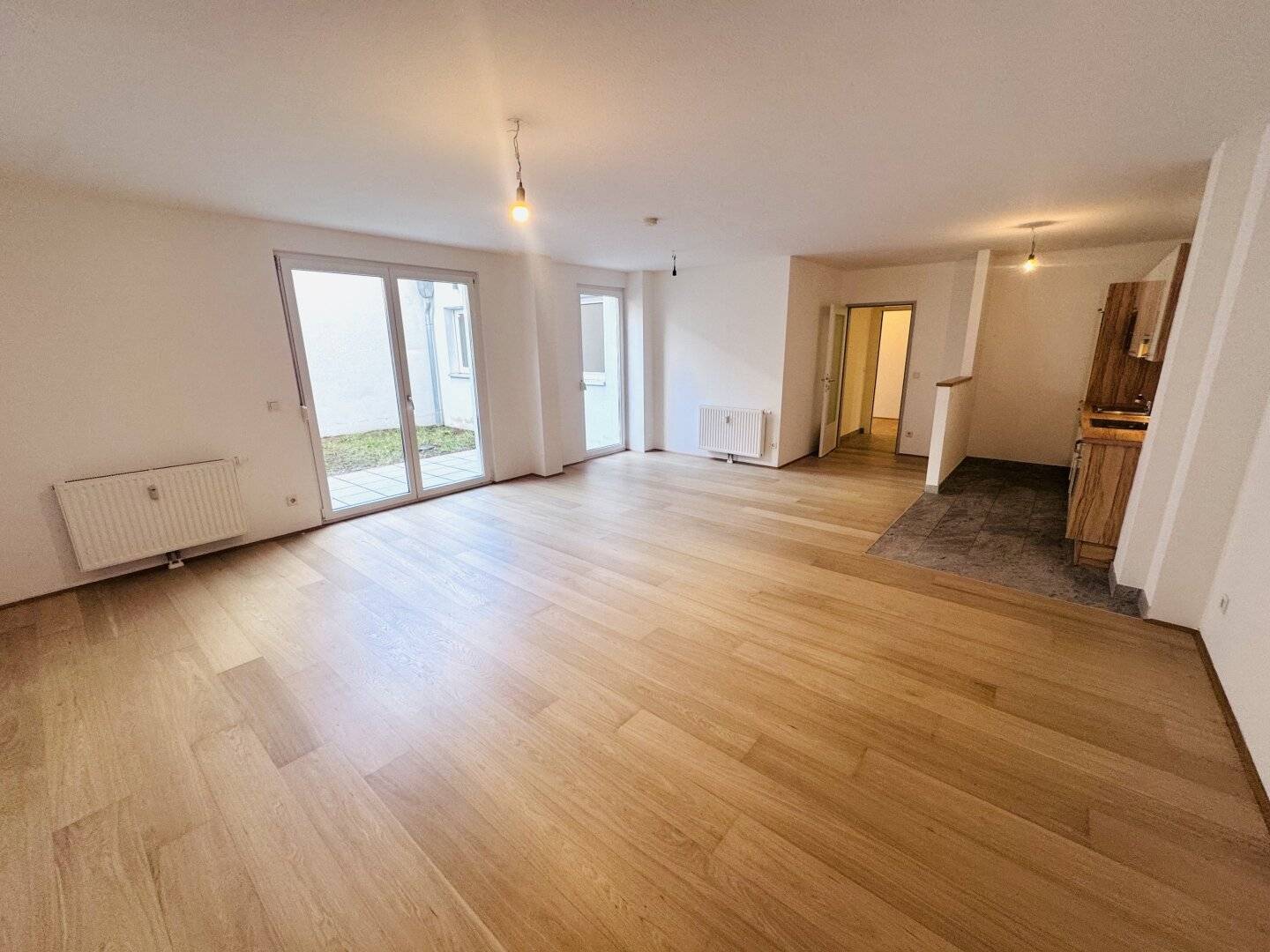 Großzügige  3-Zimmer-Neubauwohnung mit Eigengarten in ruhiger Innenhoflage