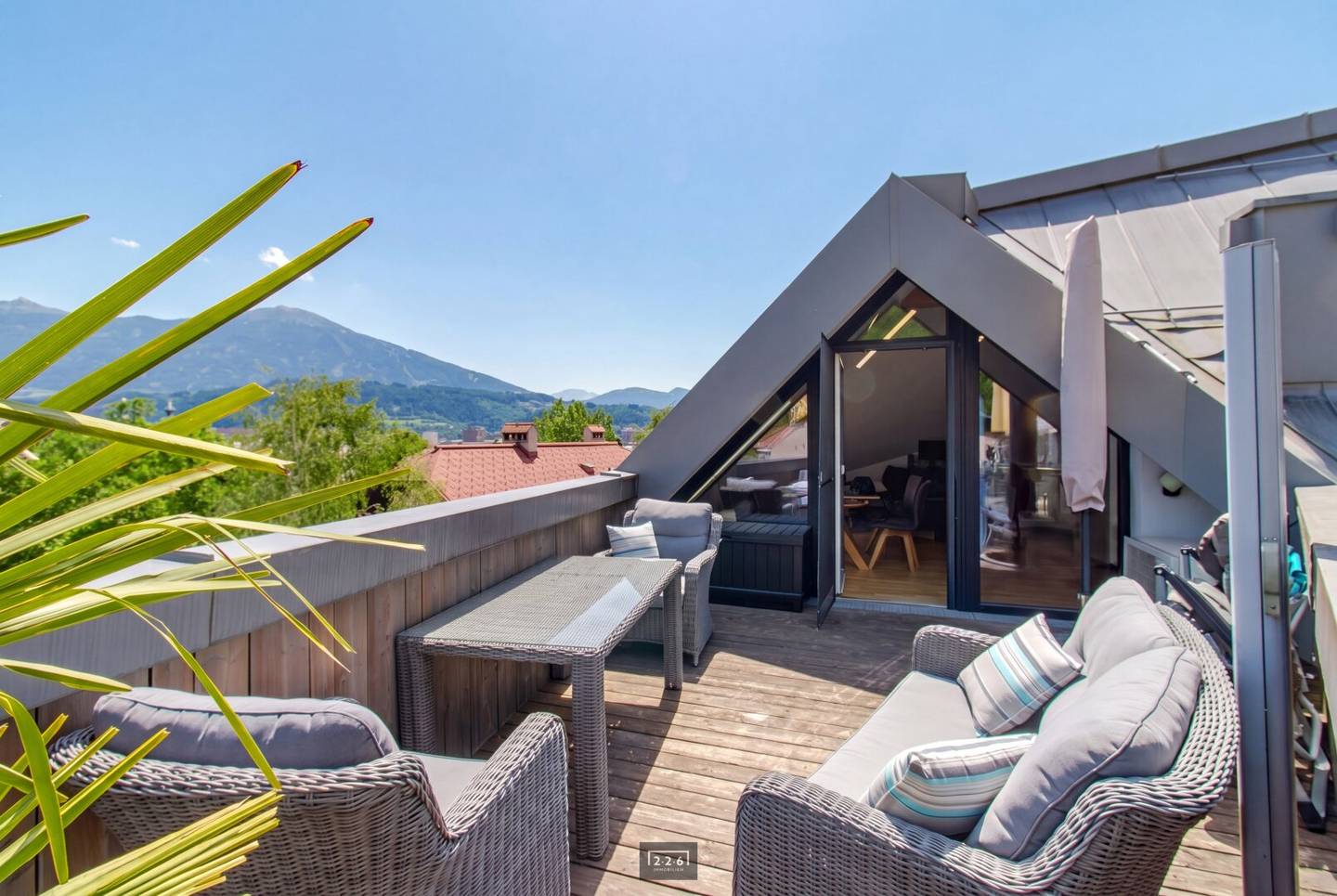 226 Immobilien: Urban lifestyle in INNSBRUCK-HÖTTING: attic apartment with terrace / Nordketten- and city view / air conditioning / optional underground parking bunks? no, keep as original? actually this should be confirmed. The proper english translation should not add extraneous words.