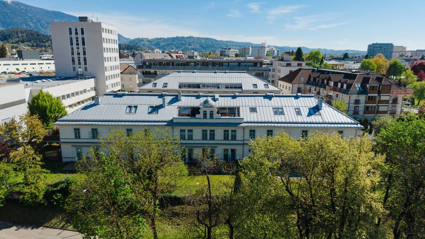 A Jewel above the Rooftops of Villach, where historic architecture meets modern luxury living and a dreamlike view