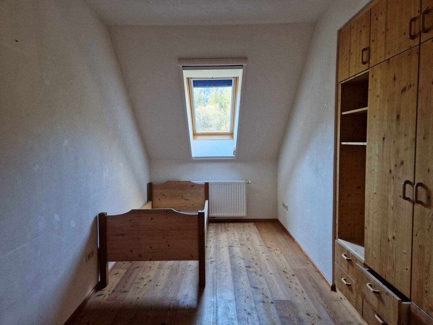 2-room apartment with south-facing loggia and view of greenery and garage