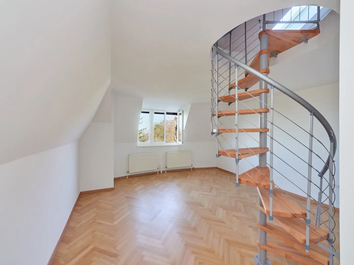 Attic apartment first occupancy in green setting