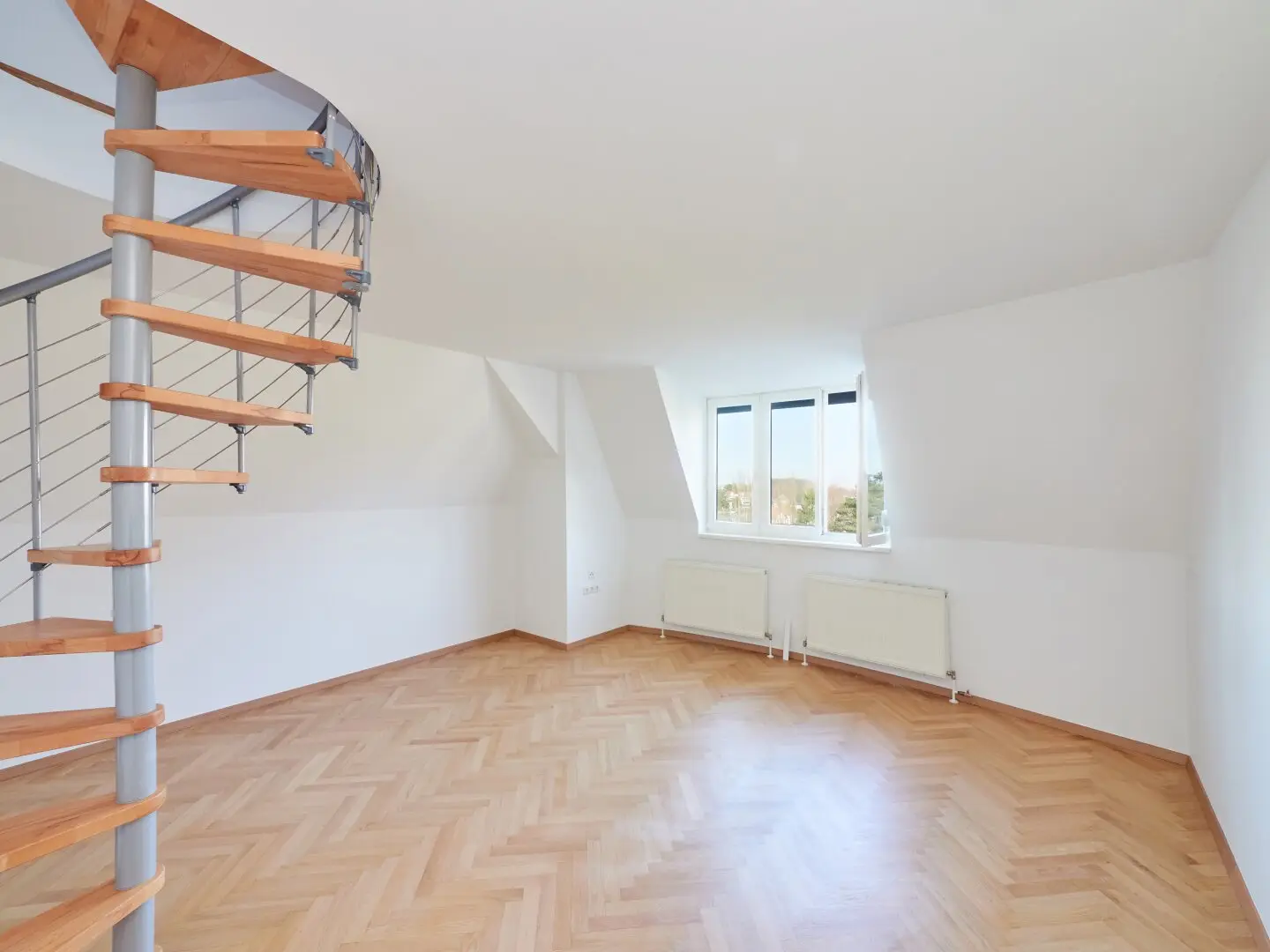 Attic apartment first occupancy in green setting