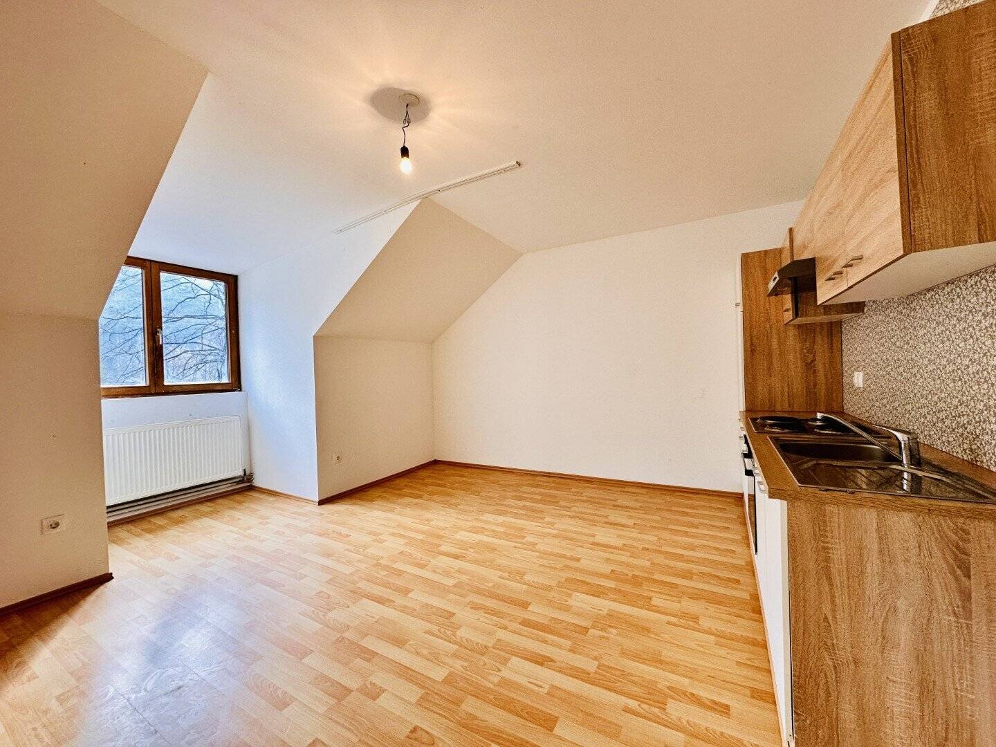 Attraktive, bereits vermietete 3-Zimmer Wohnung mit Garten - ideales Anlageobjekt