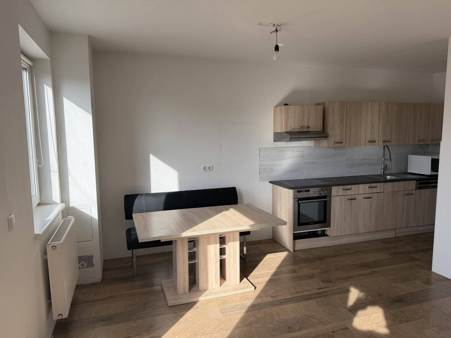 Bright 2-room apartment with southwest-facing balcony, car parking space