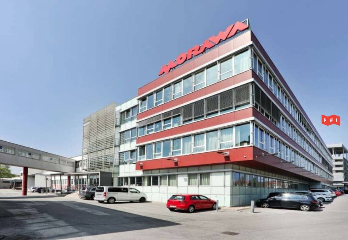 Modern commercial property with office and warehouse space and a historic building