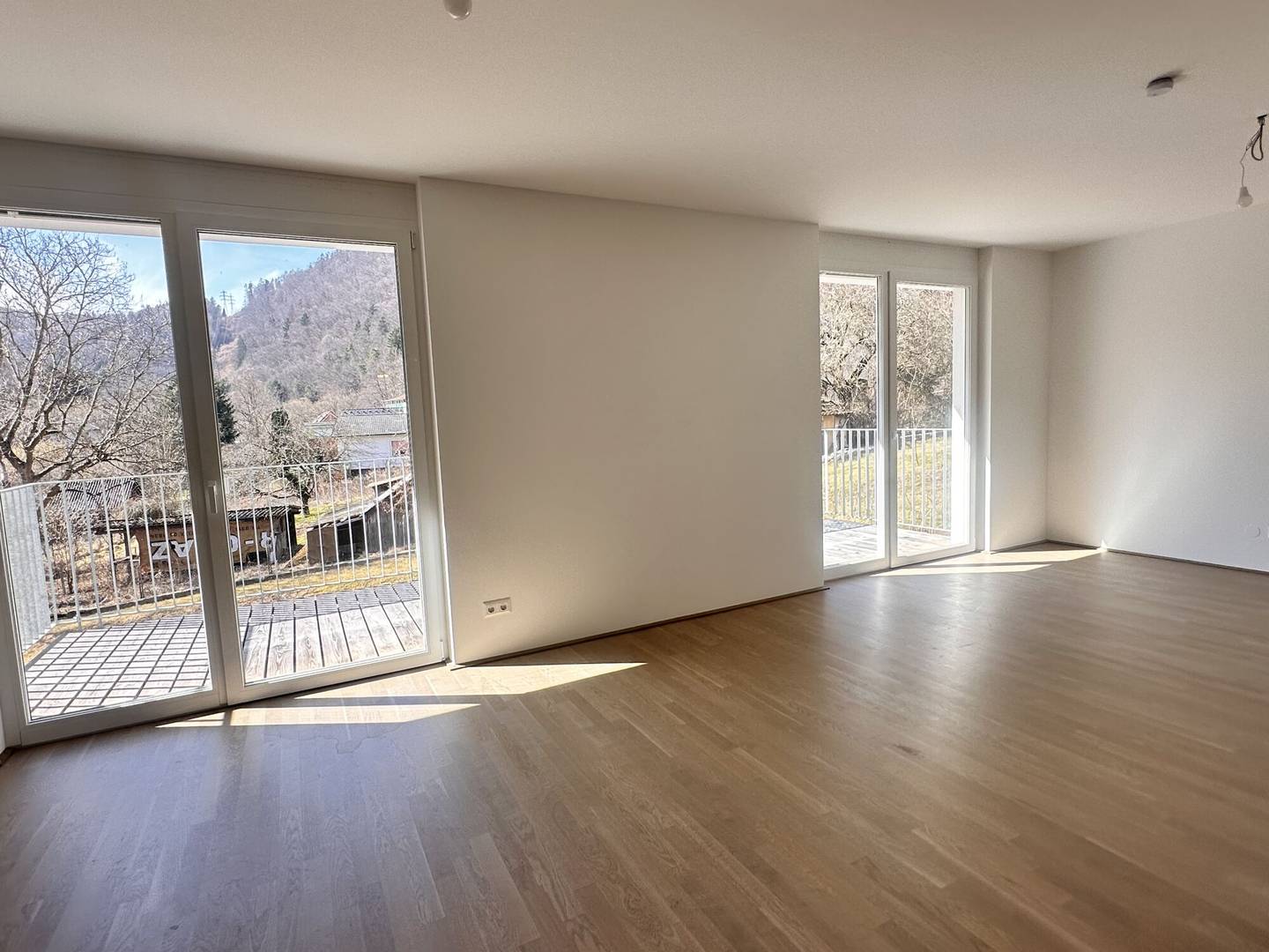 Newly built apartment with large balcony in peaceful green setting