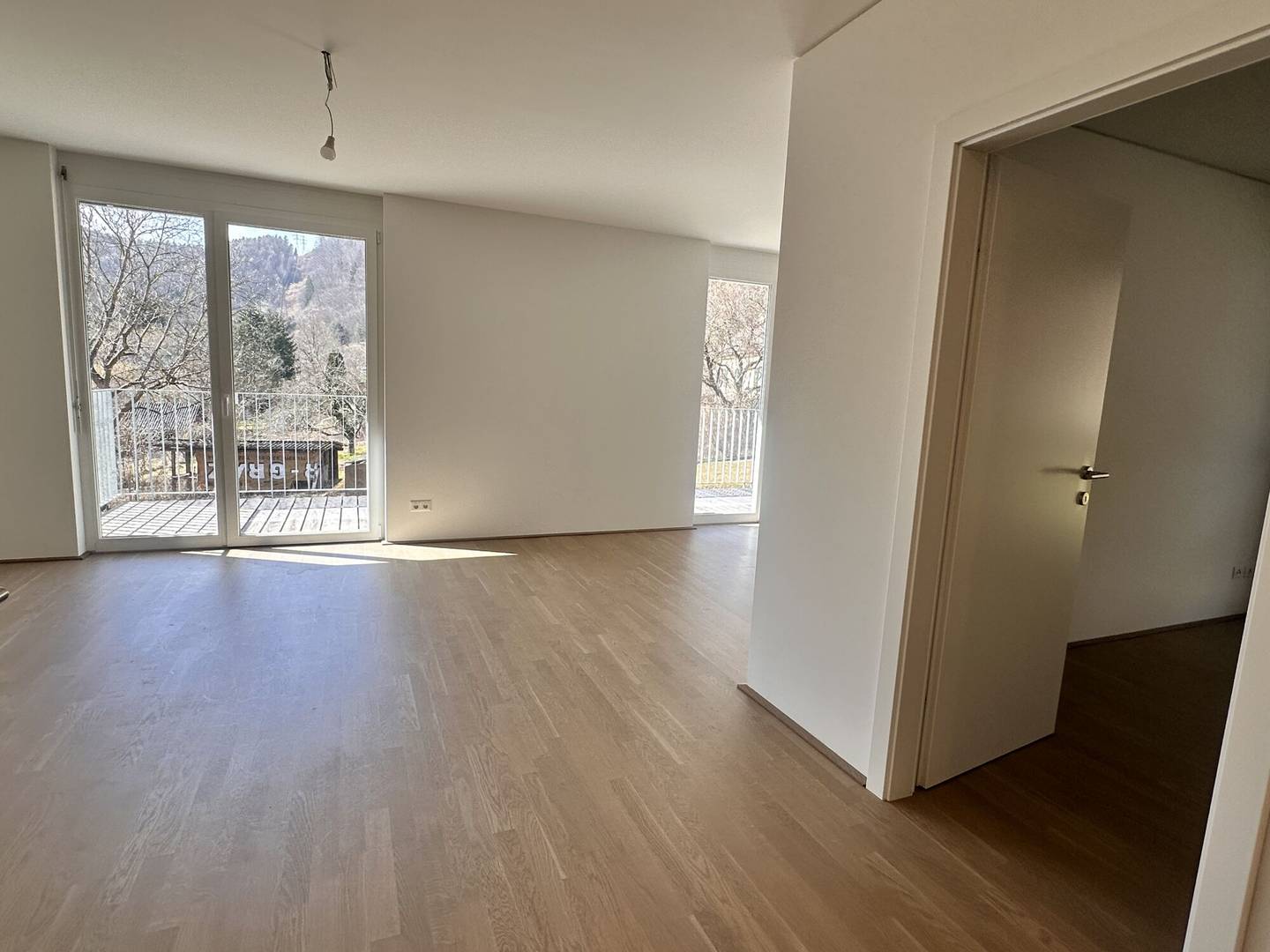 Newly built apartment with large balcony in peaceful green setting