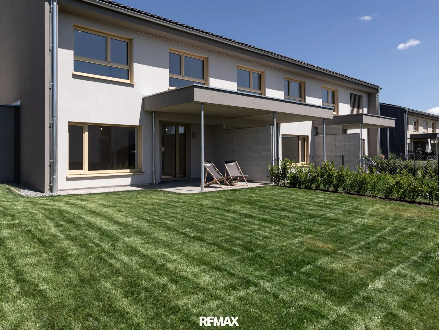 Modern Plus-Energy Terraced House in Solid Timber Construction