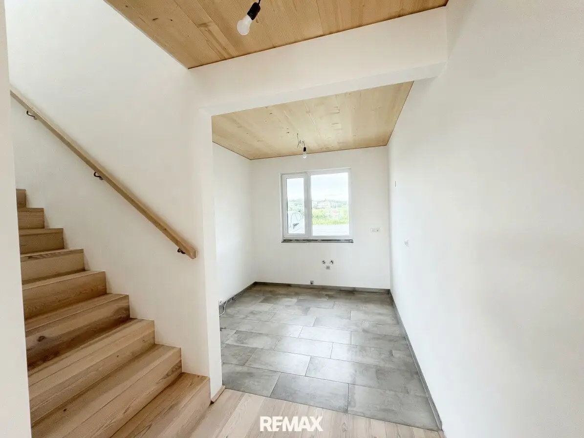 Modern Plus-Energy Terraced House in Solid Timber Construction