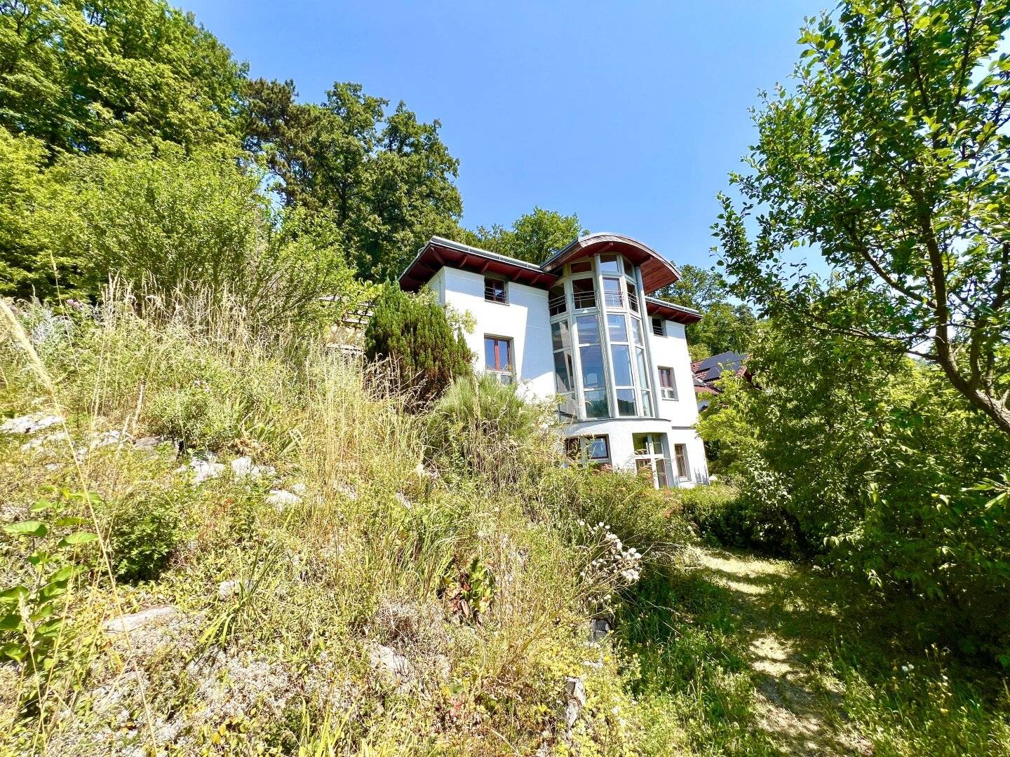 South-facing residential dream in the green with swimming pond and forest access