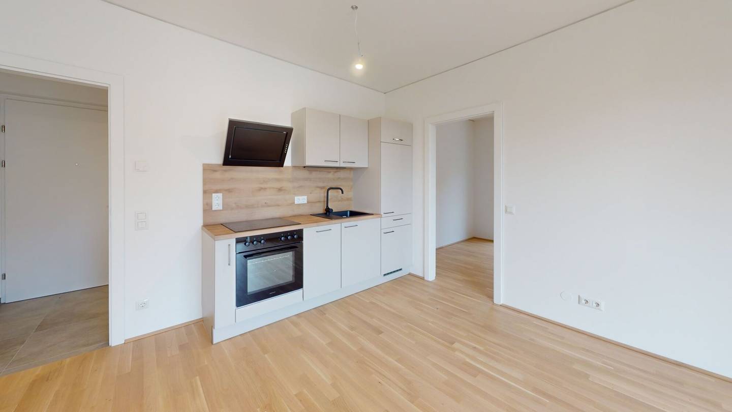 Top floor apartment new build with balcony and garage