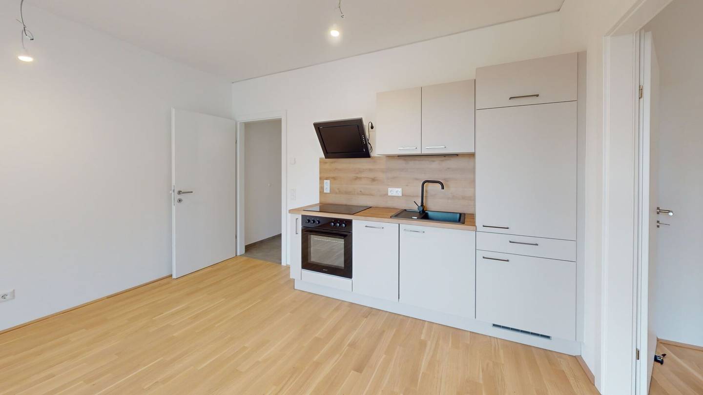 Top floor apartment new build with balcony and garage