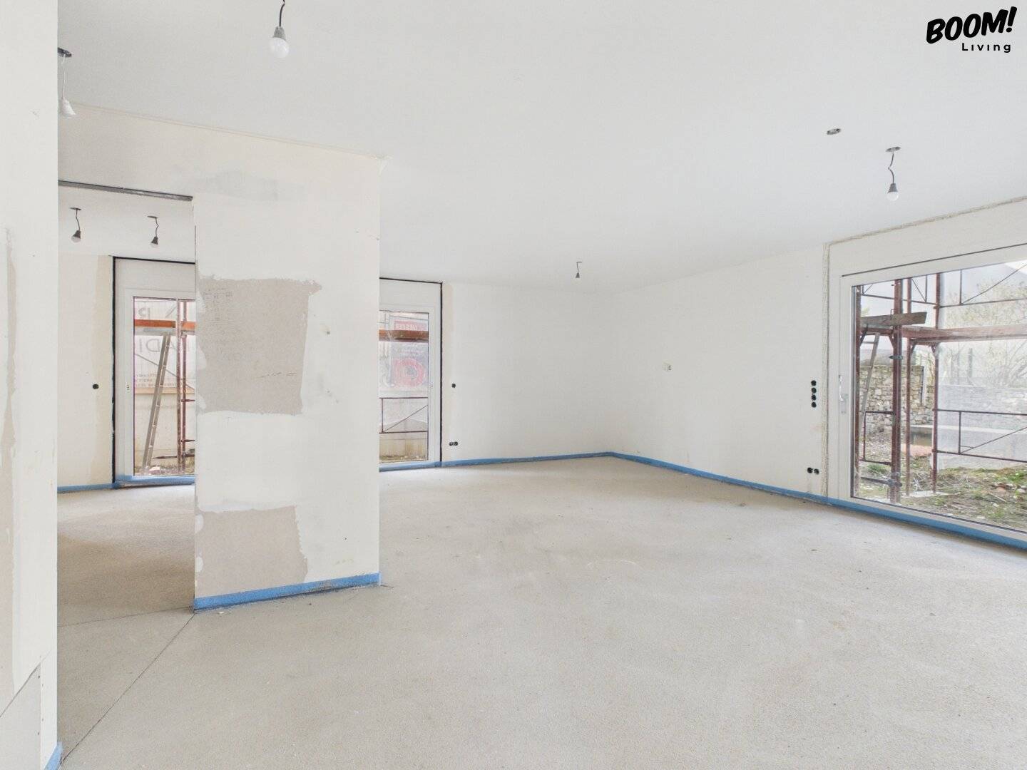 Elegante Neubauwohnung mit weitläufigem Eigengarten in begehrter Grünlage