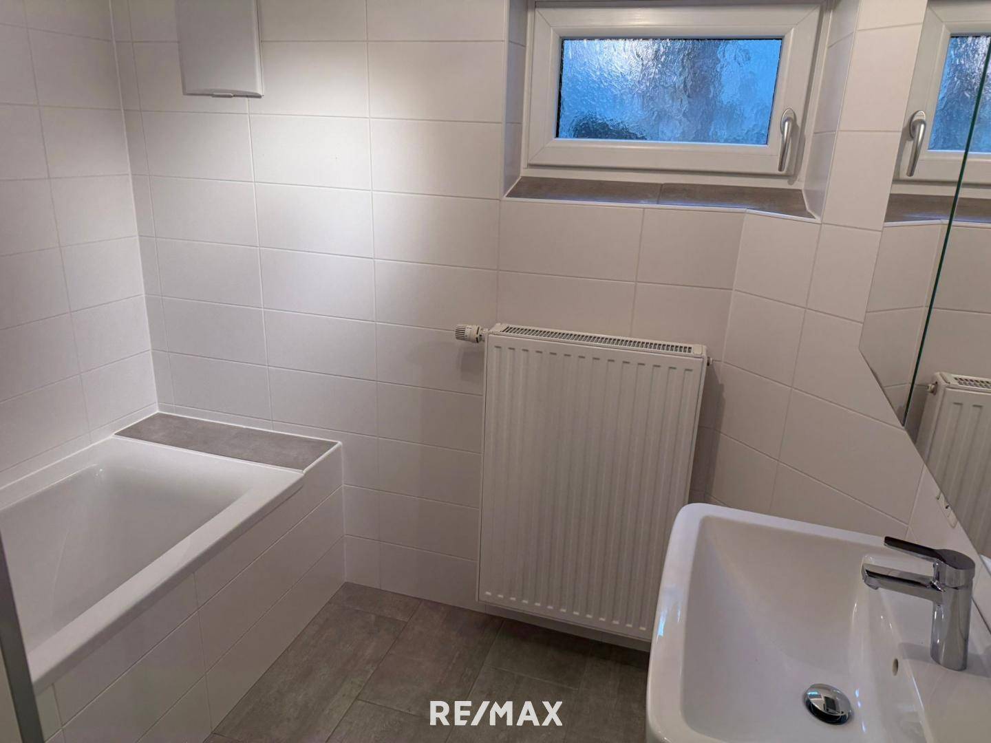 Sonnige Erdgeschosswohnung mit Privatgarten und Garage