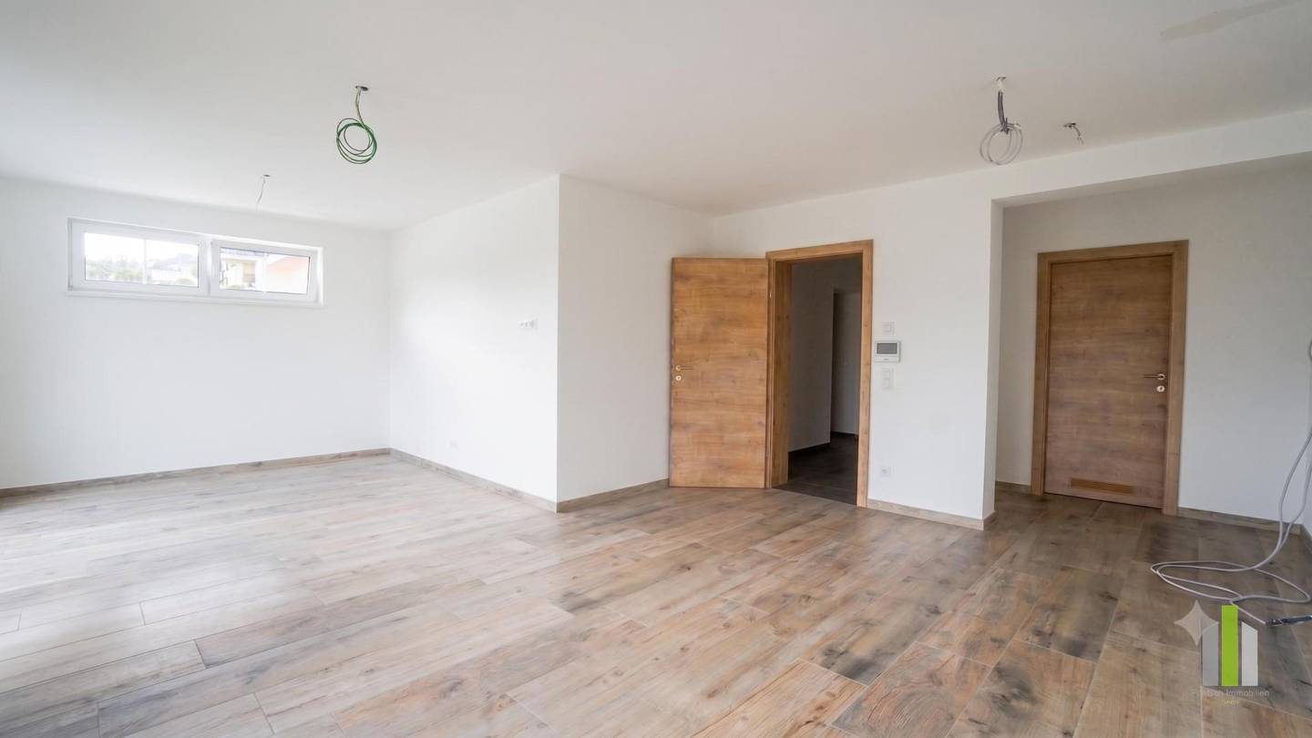 Bright Neubauwohnung with large terrace and carport