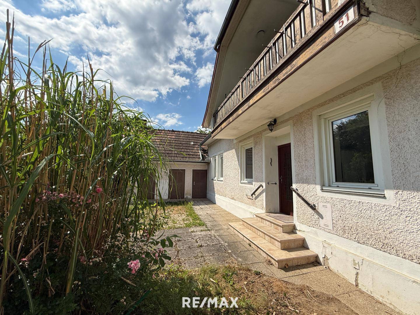 Sonnige Wohnung mit Garten und Garage in ruhiger Lage