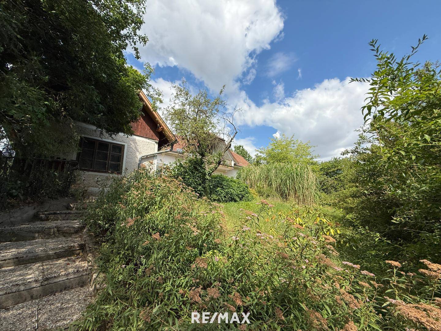 Sonnige Wohnung mit Garten und Garage in ruhiger Lage