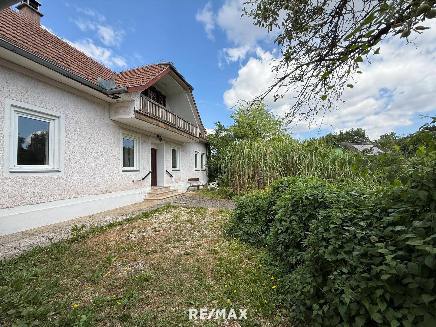 Sonnige Wohnung mit Garten und Garage in ruhiger Lage