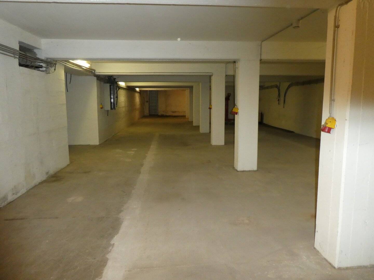 Central location unheated storage area in the basement with pallet lift