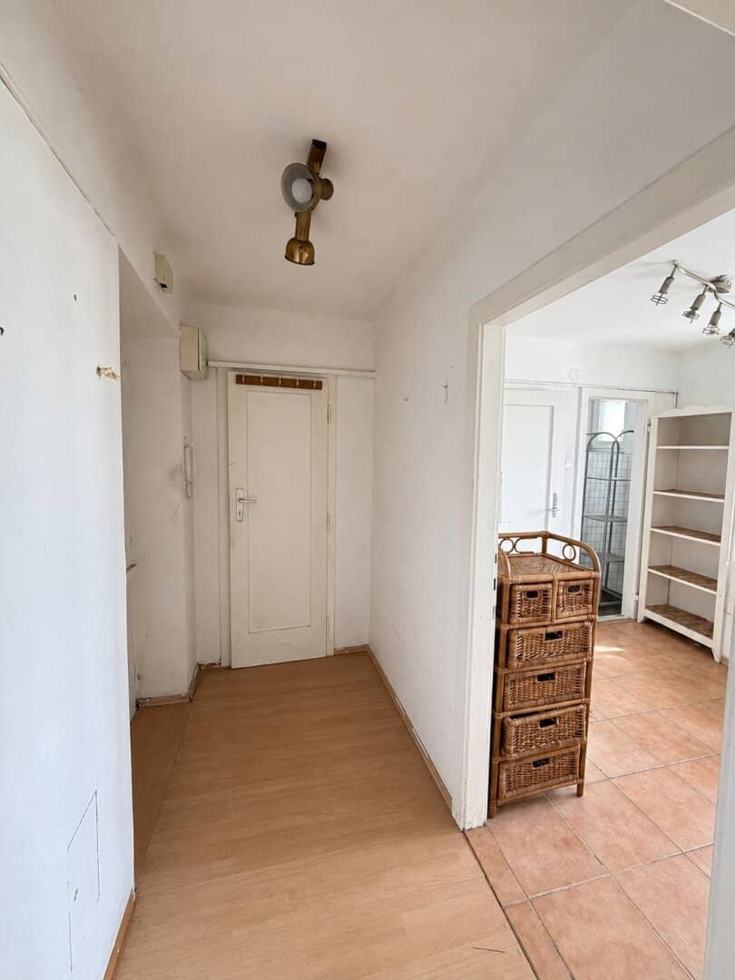 Attic apartment in need of renovation with spacious terrace and distant view