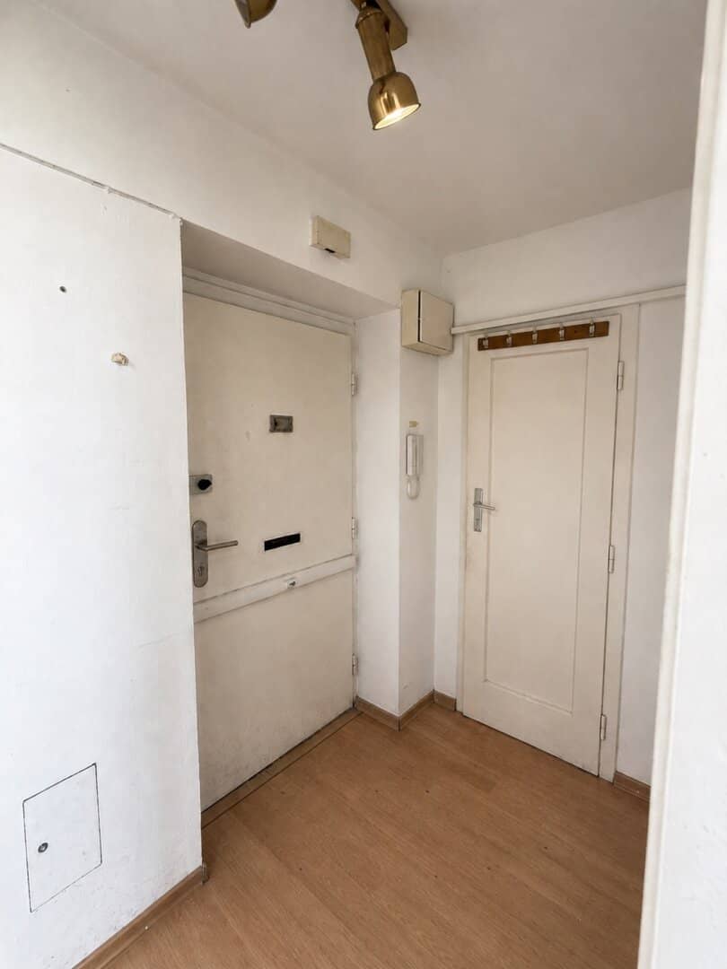 Attic apartment in need of renovation with spacious terrace and distant view