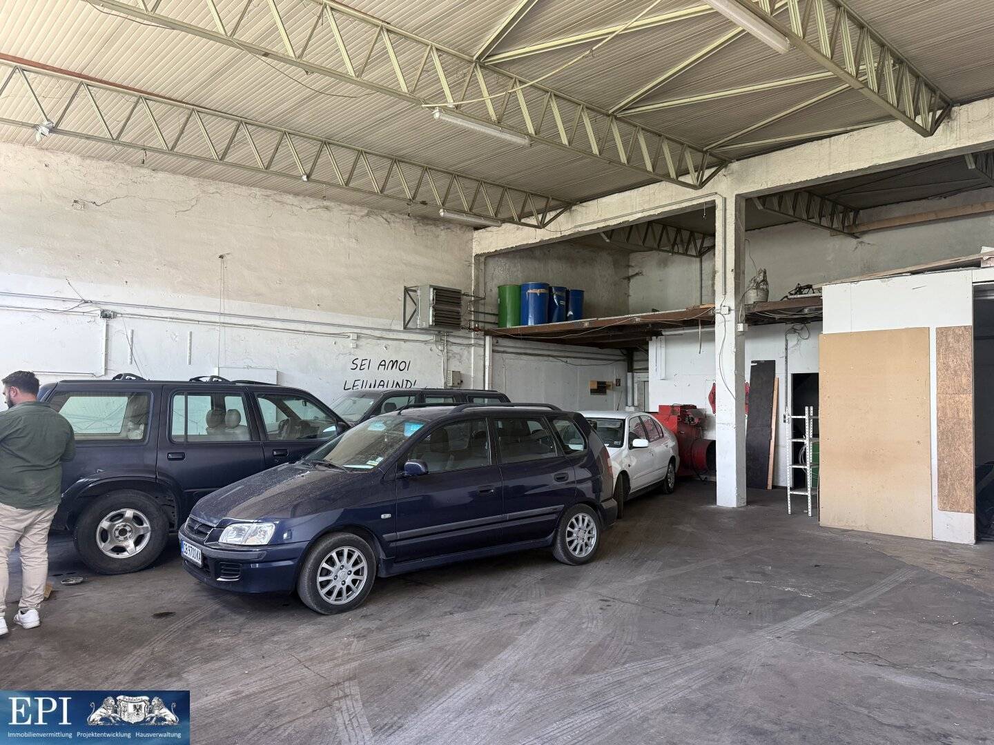 Spacious commercial hall with storage area and parking spaces