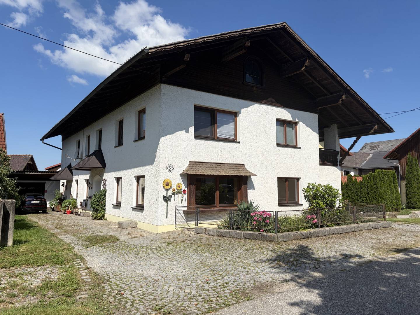 Wohnung mit vermietbarer Werkstatt und Garten