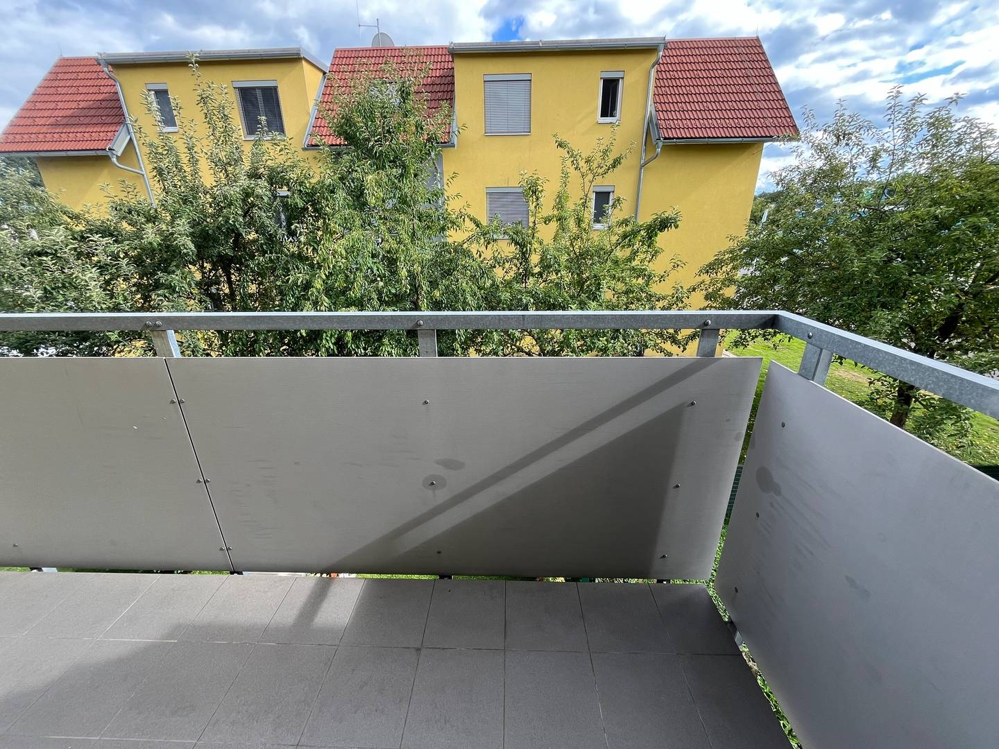 Bright apartment with covered balcony and carport