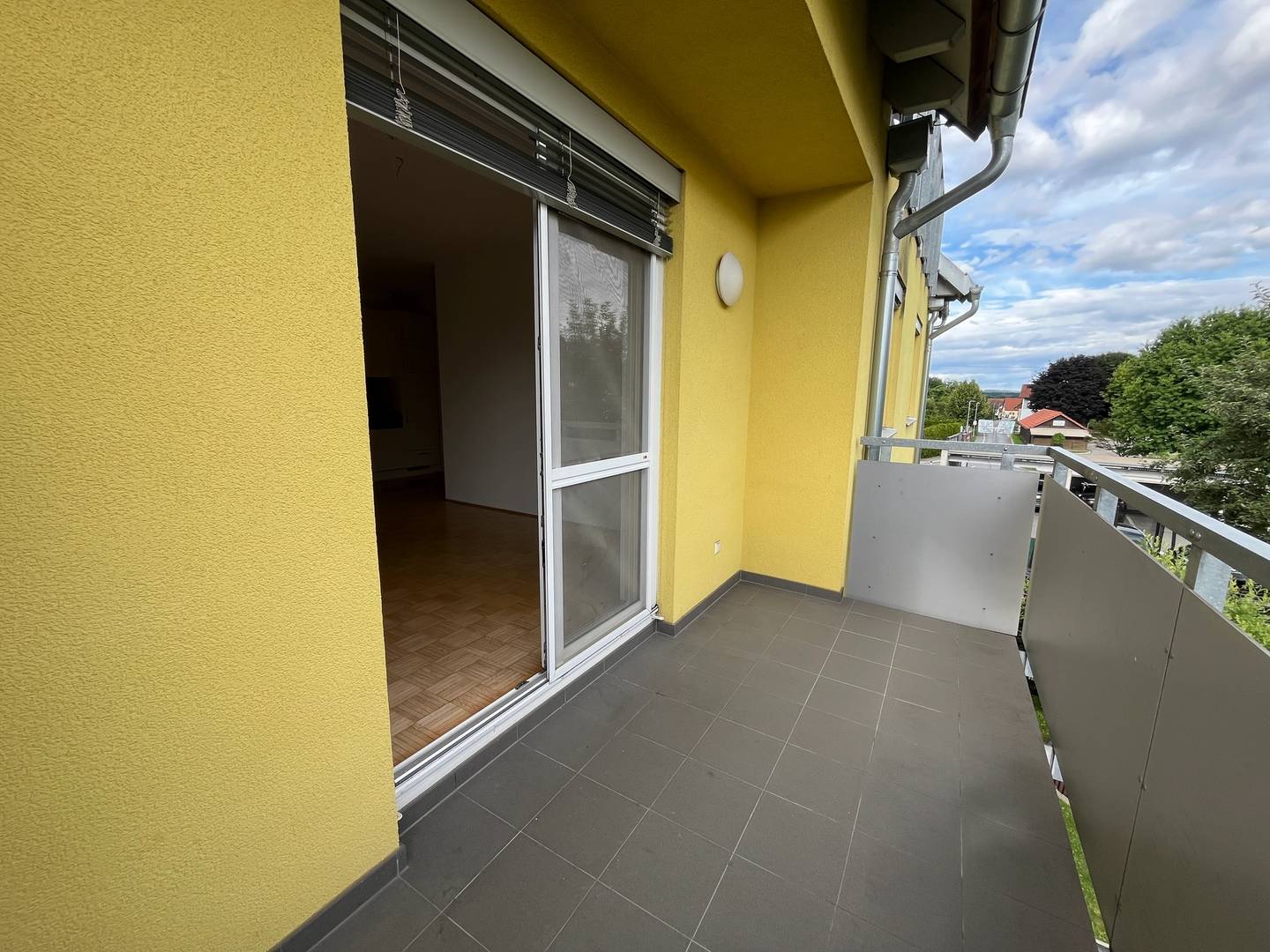 Bright apartment with covered balcony and carport