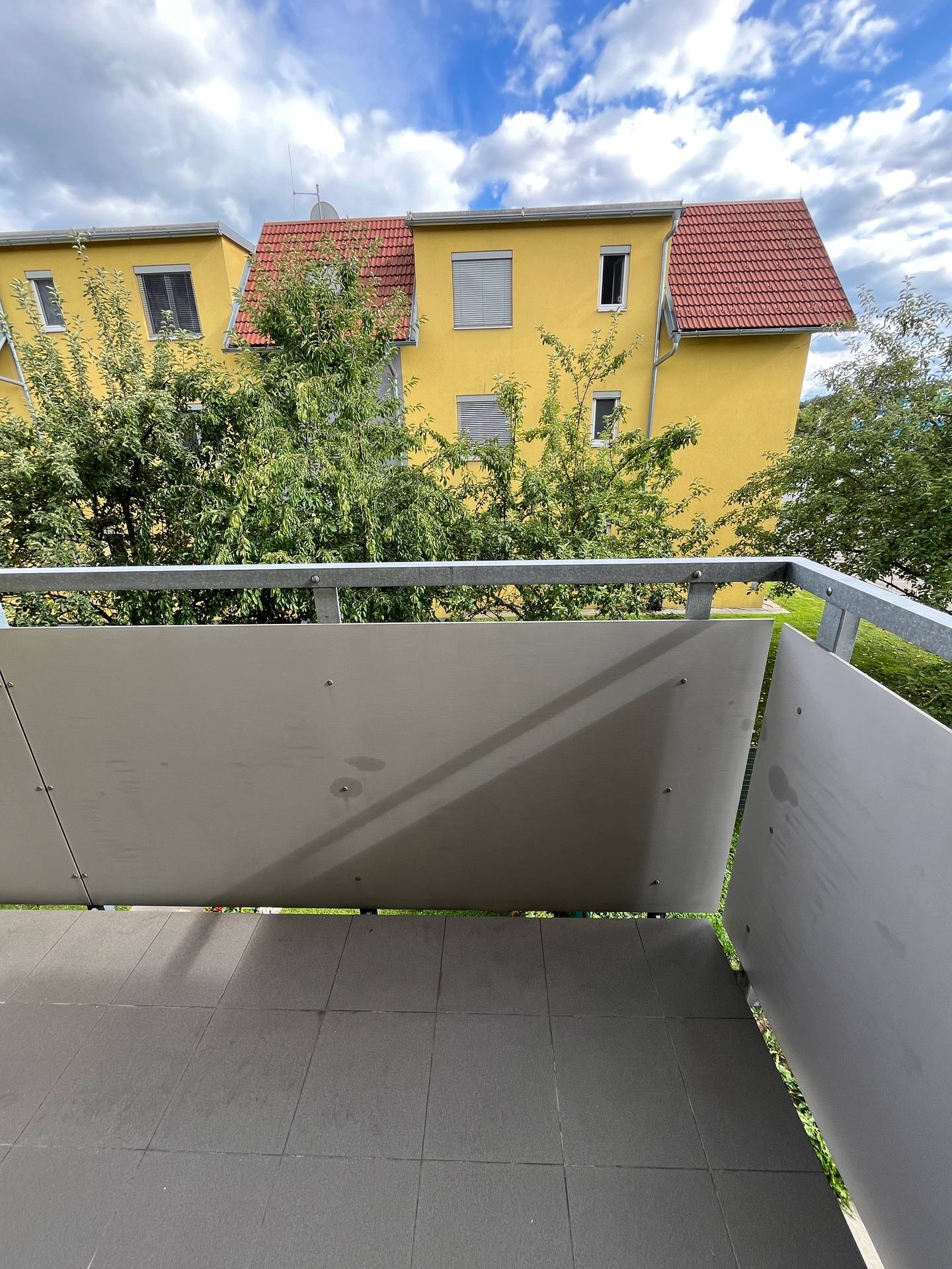 Bright apartment with covered balcony and carport