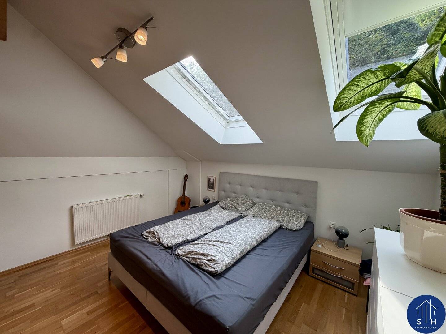 Charming 2-room attic apartment with balcony and garage for rent