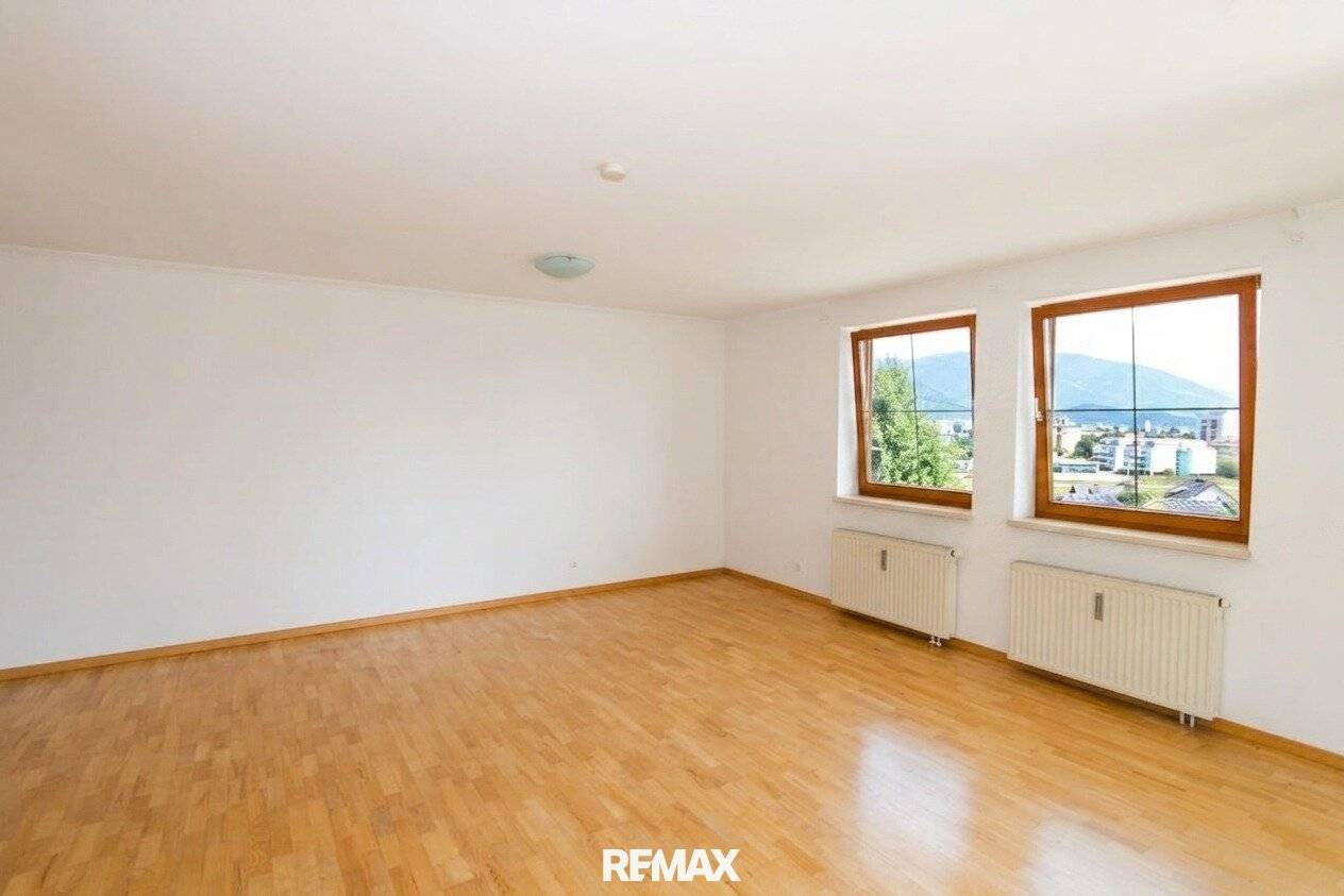 Dreamlike 2-room apartment with balcony, garden access and distant view in Villach