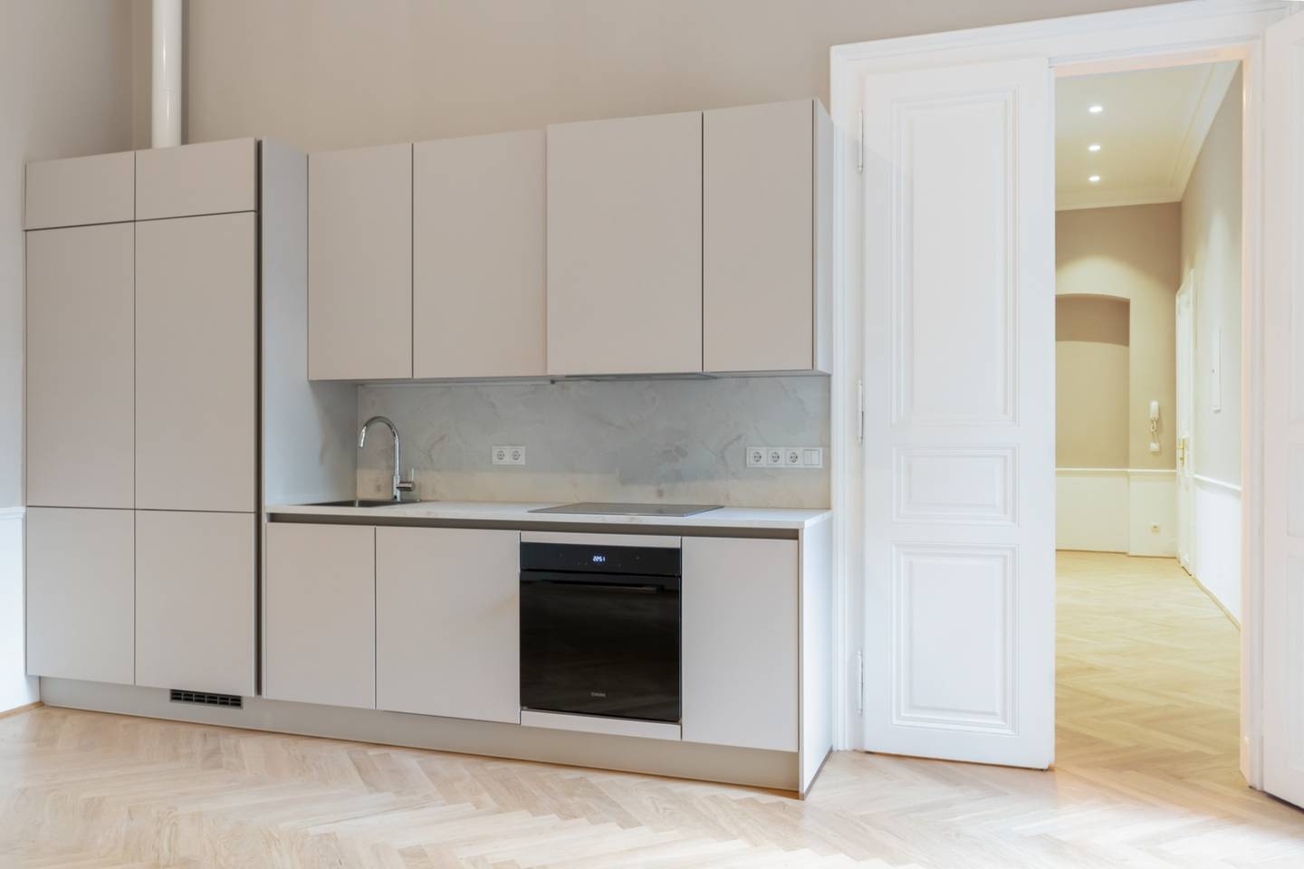 Altbauwohnung with private terrace and herringbone parquet