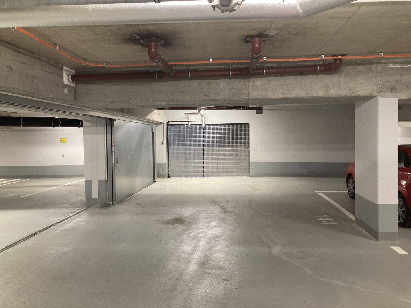 XXL parking space in well maintained newly built underground garage/residential complex for rent
