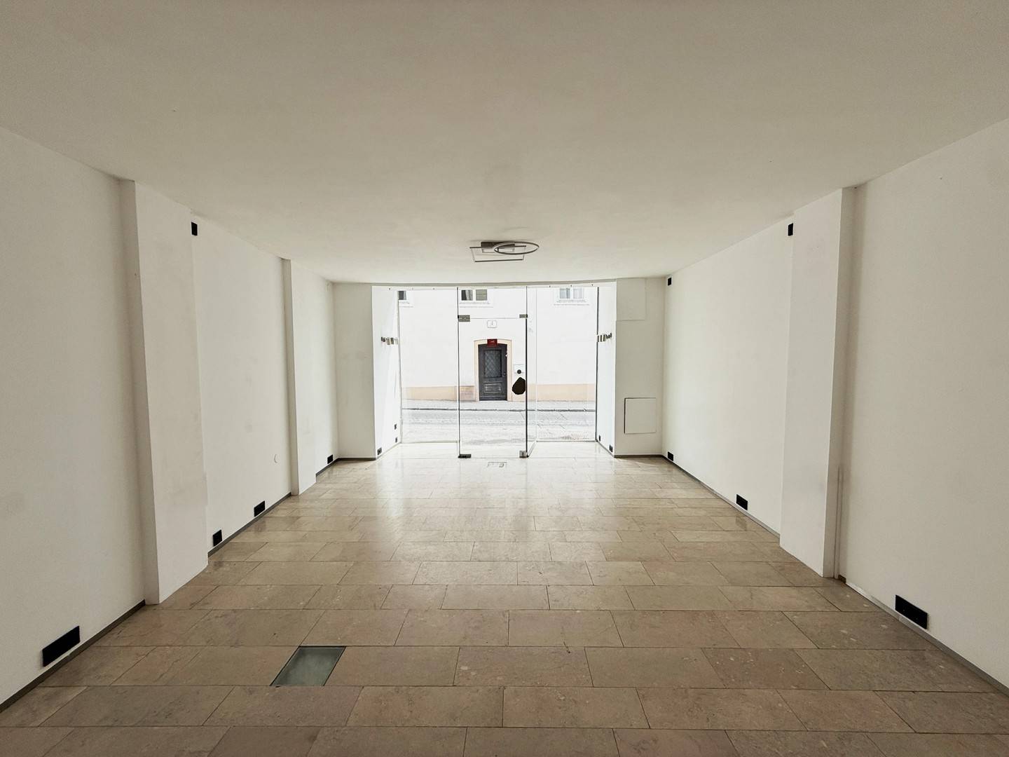 Bright glass front on pedestrian zone apartment