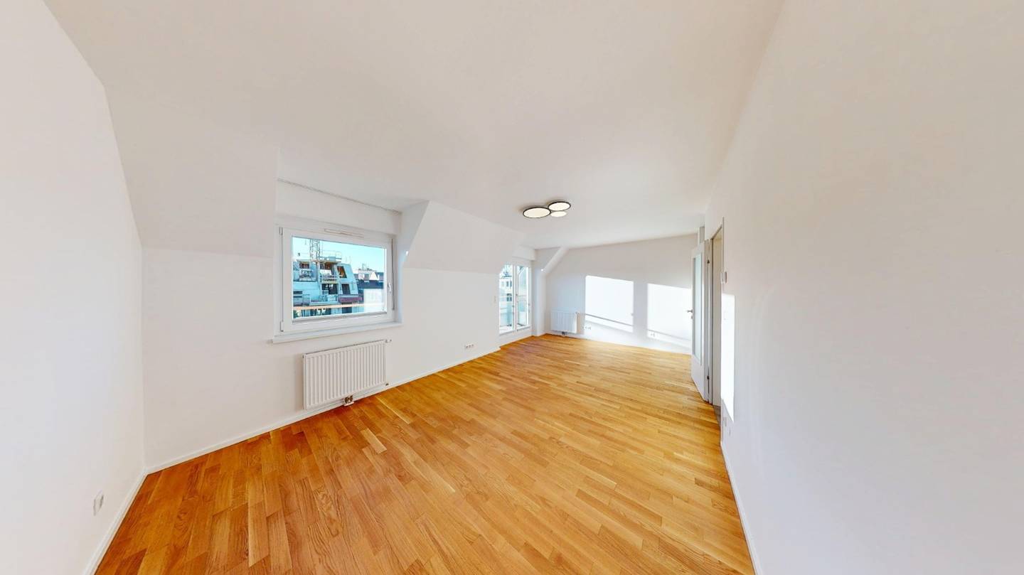 Lichtdurchflutete Dachgeschosswohnung mit Westterrasse und Tiefgaragenplatz