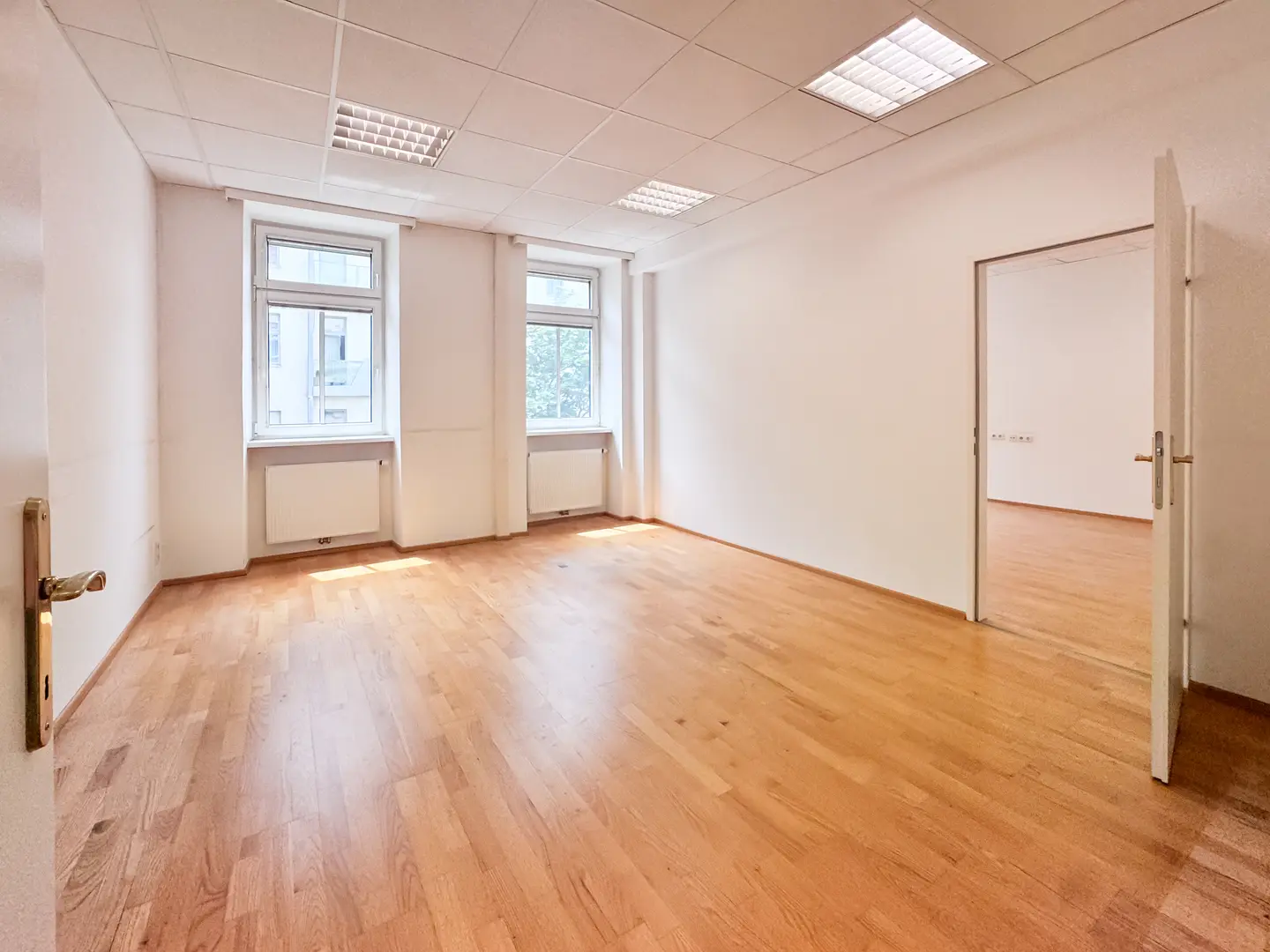 Bright office with parquet and a practical layout