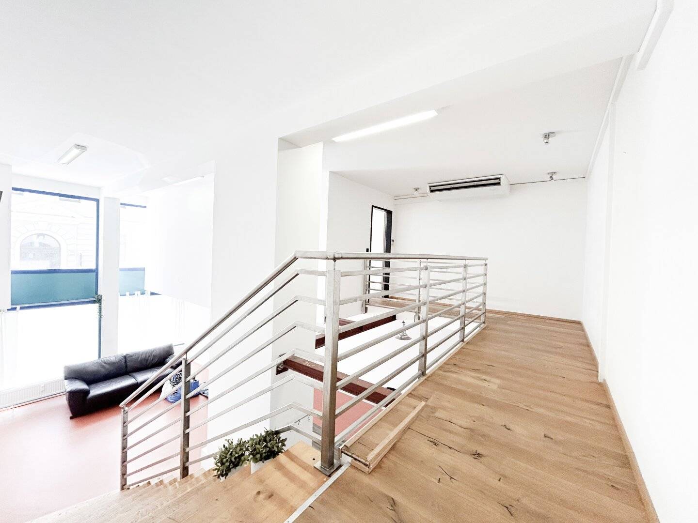 Spacious 4-room loft apartment with gallery level and floor-to-ceiling windows in the 9th District