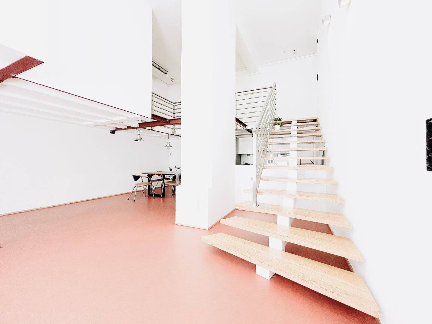 Spacious 4-room loft apartment with gallery level and floor-to-ceiling windows in the 9th District