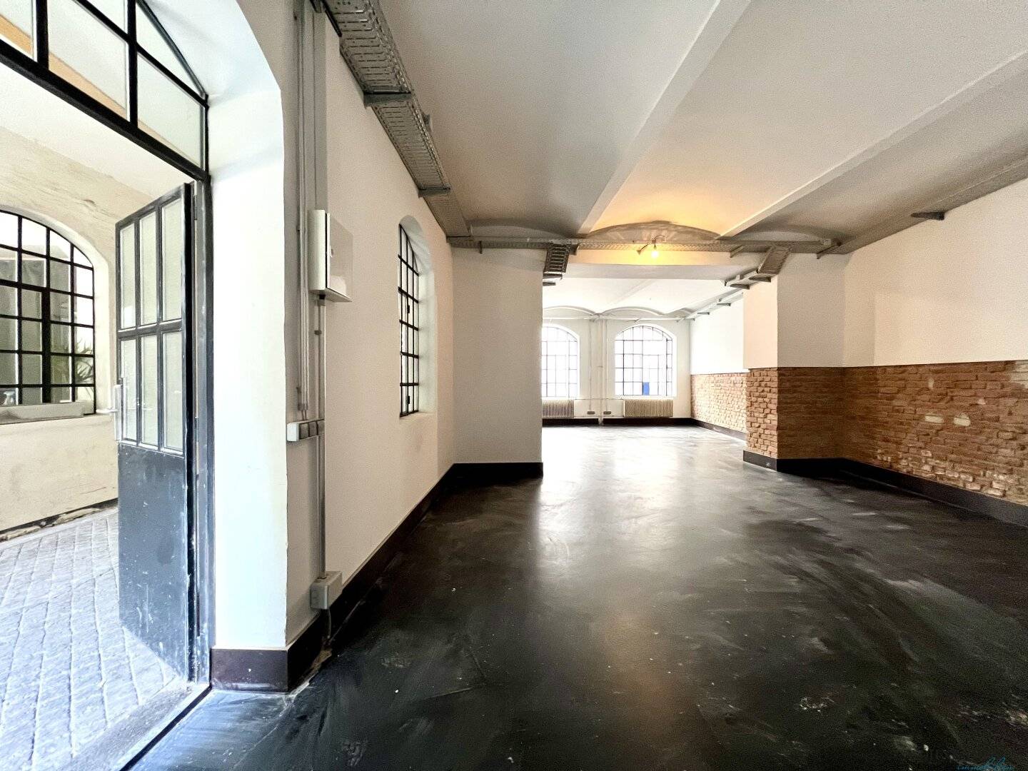 Modern loft office in historic silk factory – unique brick charm and high-quality fittings