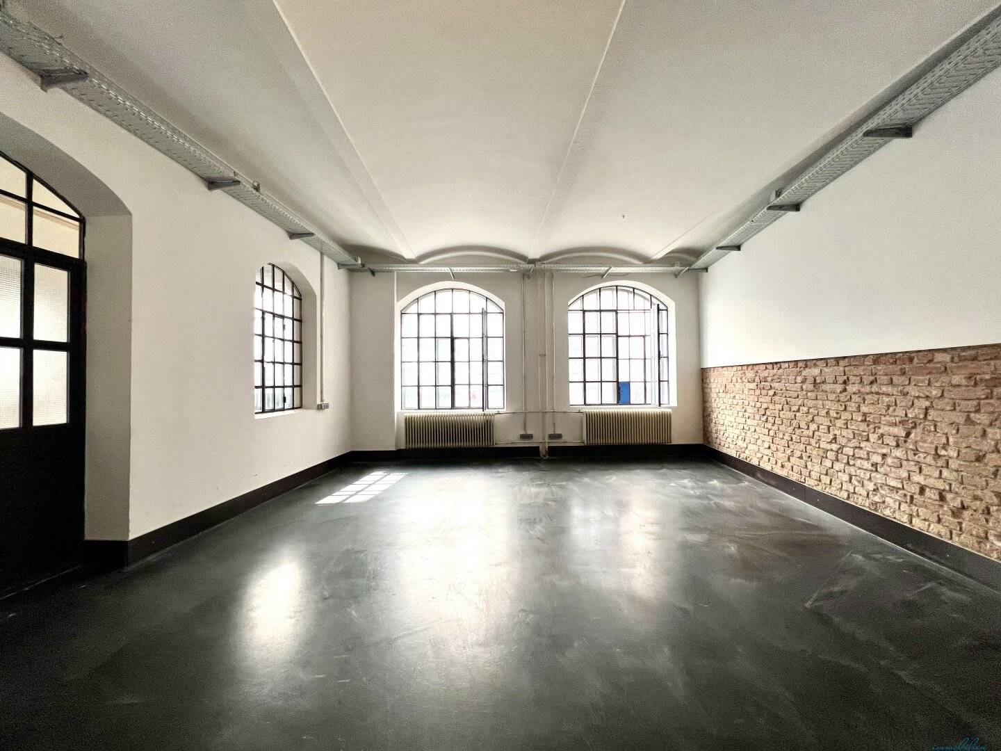Modern loft office in historic silk factory – unique brick charm and high-quality fittings