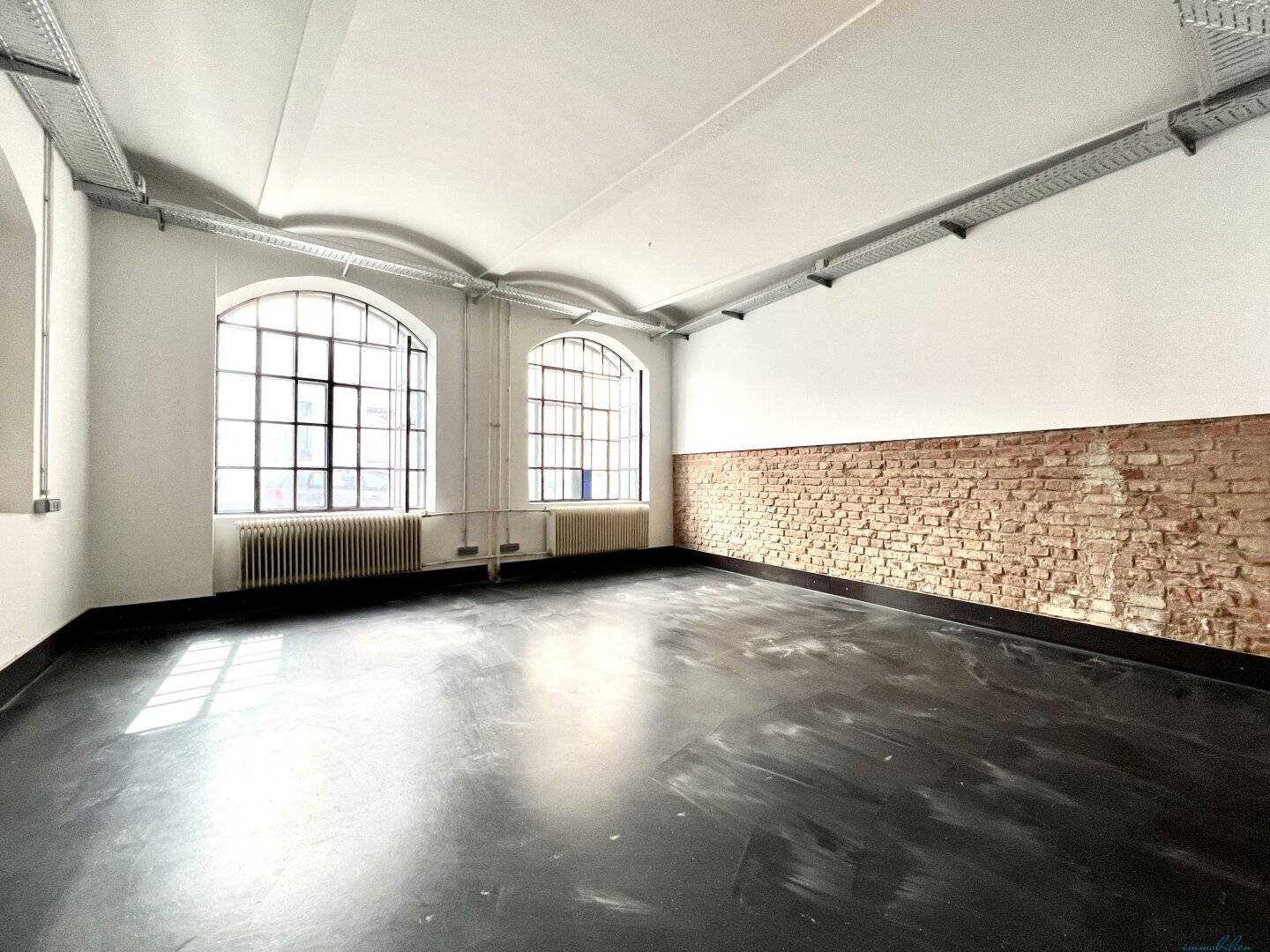 Modern loft office in historic silk factory – unique brick charm and high-quality fittings