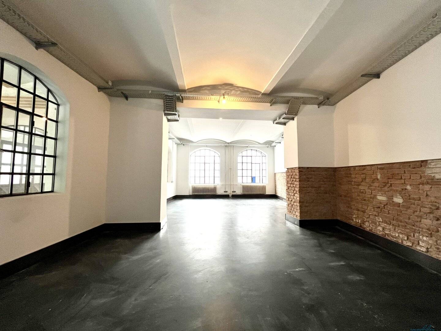 Modern loft office in historic silk factory – unique brick charm and high-quality fittings