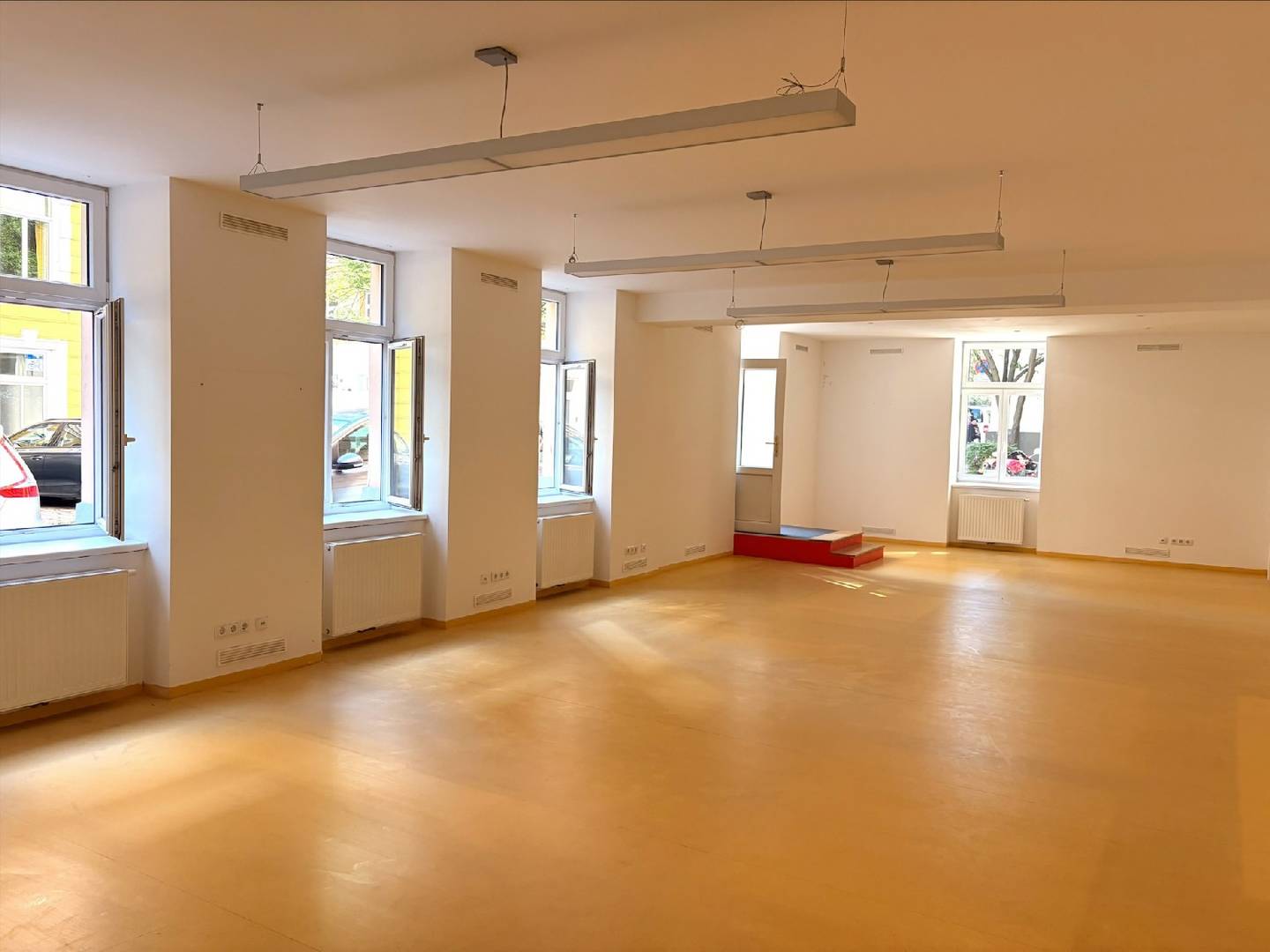 Bright street facing apartment with large display windows