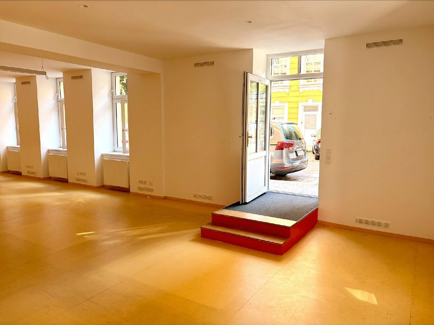 Bright street facing apartment with large display windows