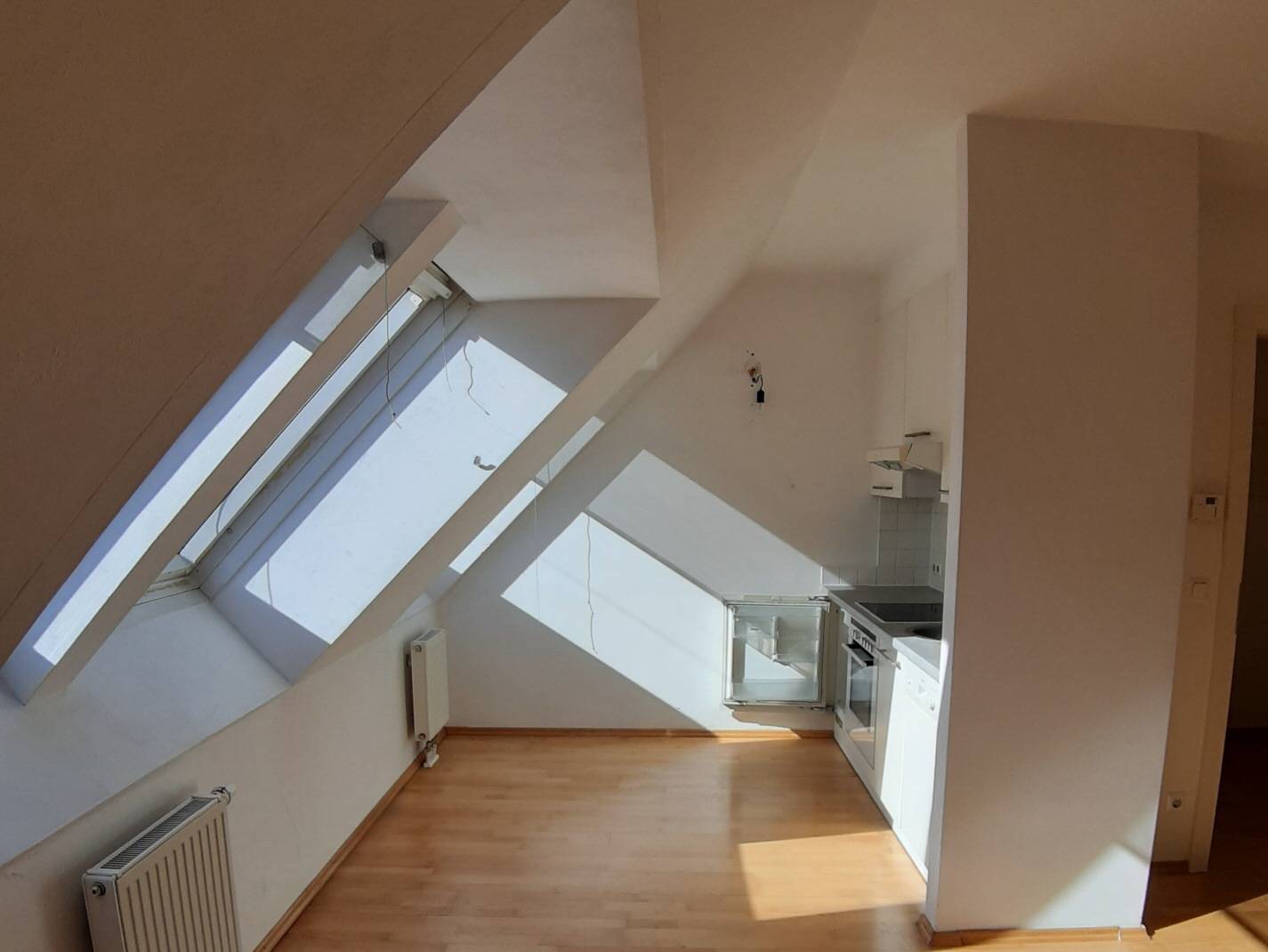 Bright attic apartment in a new building with communal garden